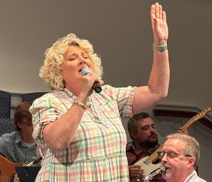 Worship leader singing during a service